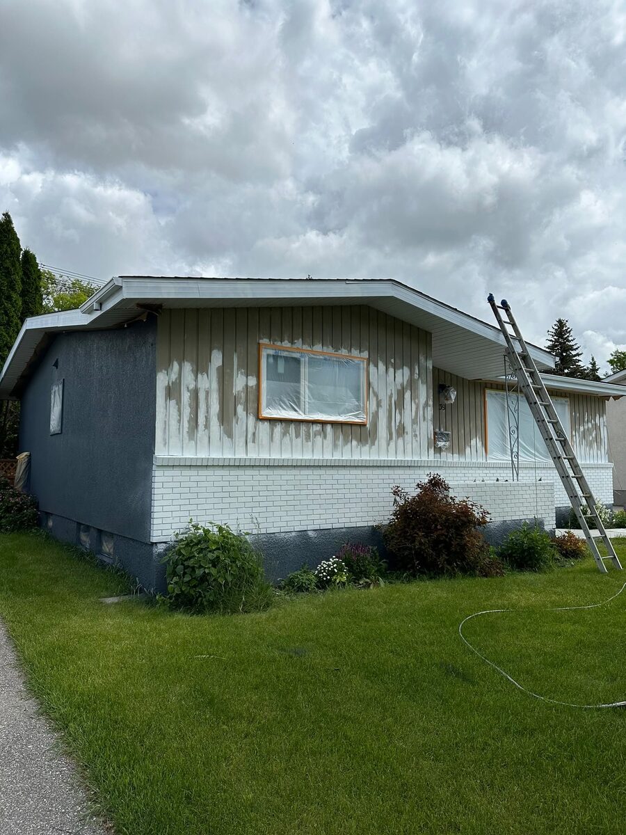 Exterior house surface preparation in progress before painting