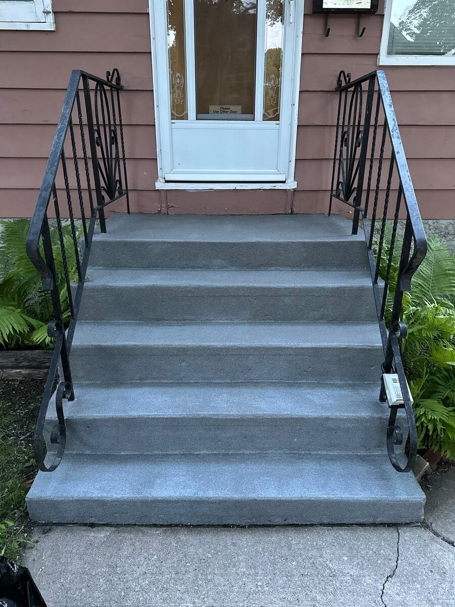 Exterior wooden stairs after restoration and repainting
