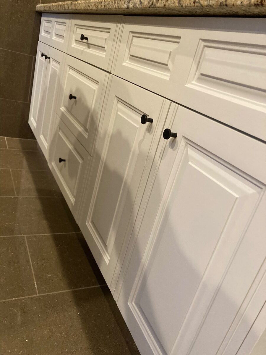 Interior cabinets freshly painted white in a Calgary property