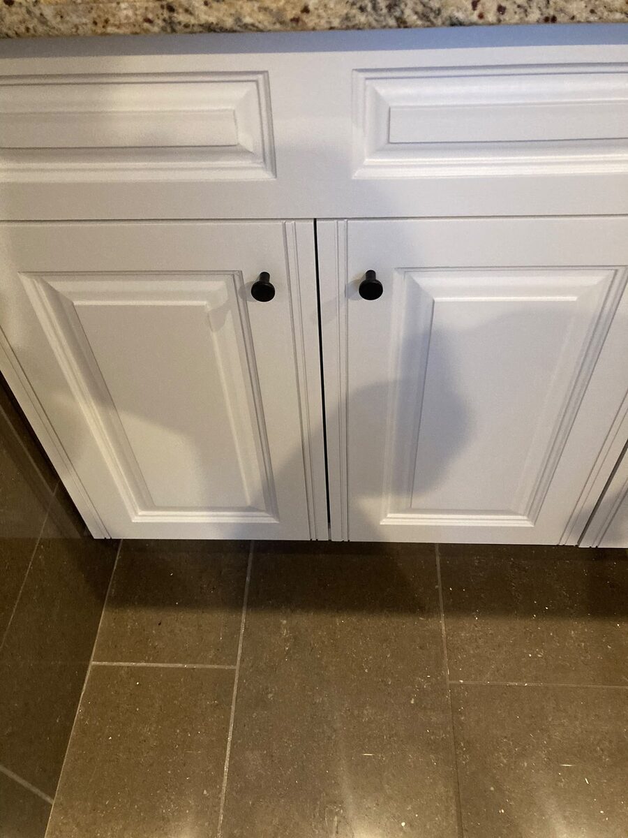 Interior cabinets freshly painted white in a Calgary property